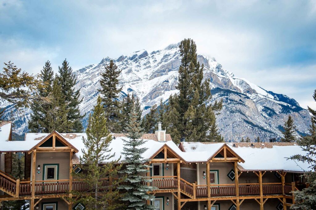 Cozy lodge room with fireplace at a Banff mountain accommodation Cozy lodge room with fireplace at a Banff mountain accommodation